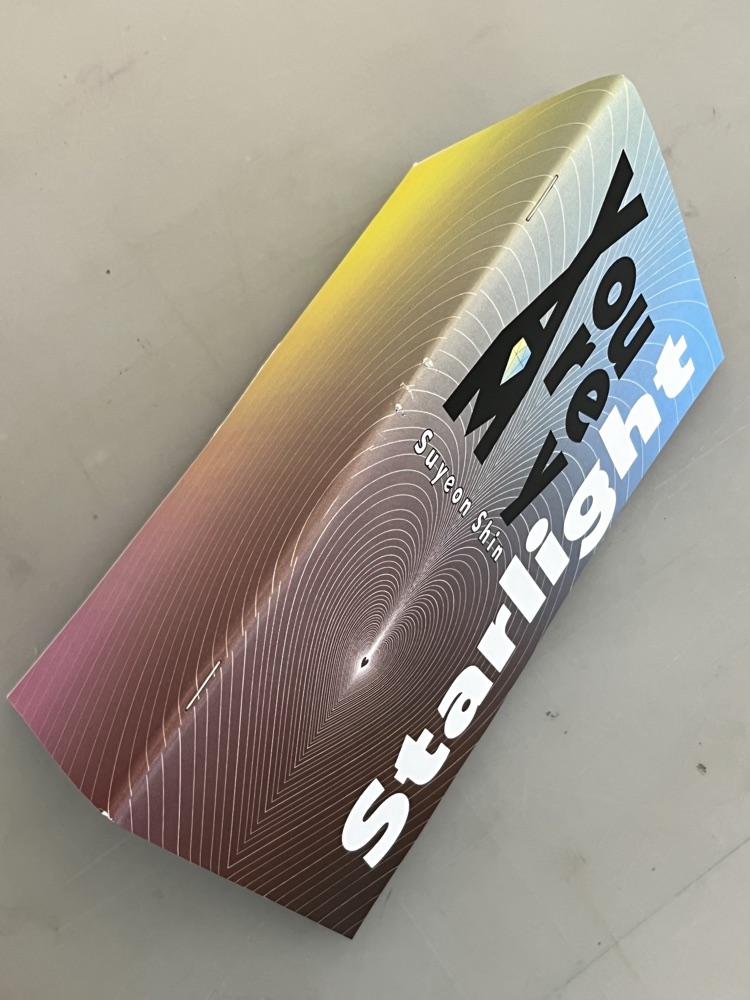 The songbook folded open along its spine